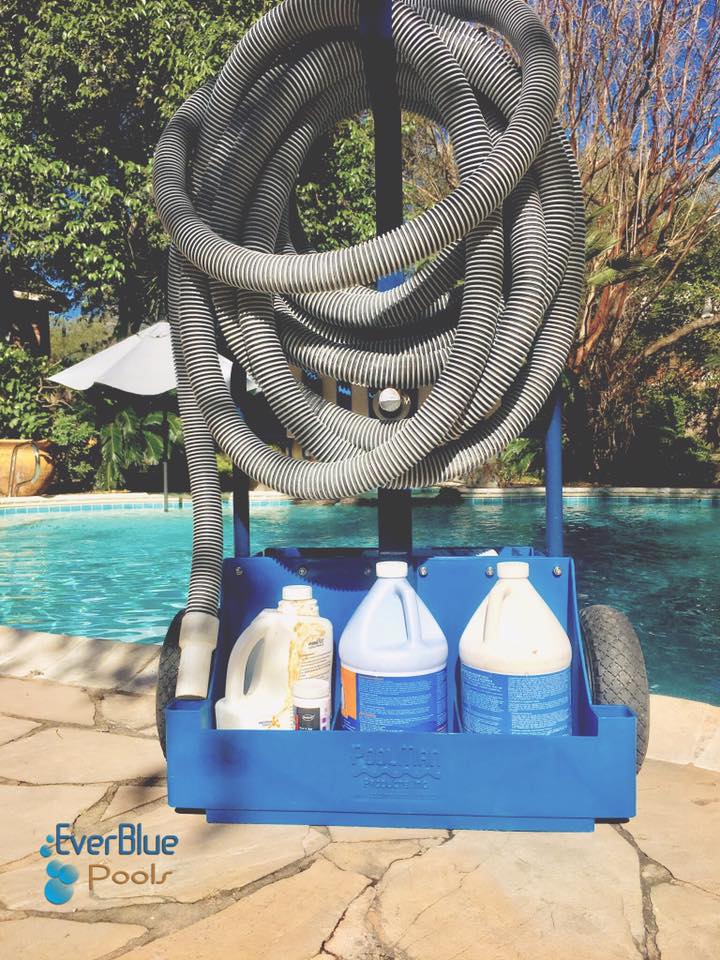 poolcleaningtools_n Pool maintenance tools on pool deck